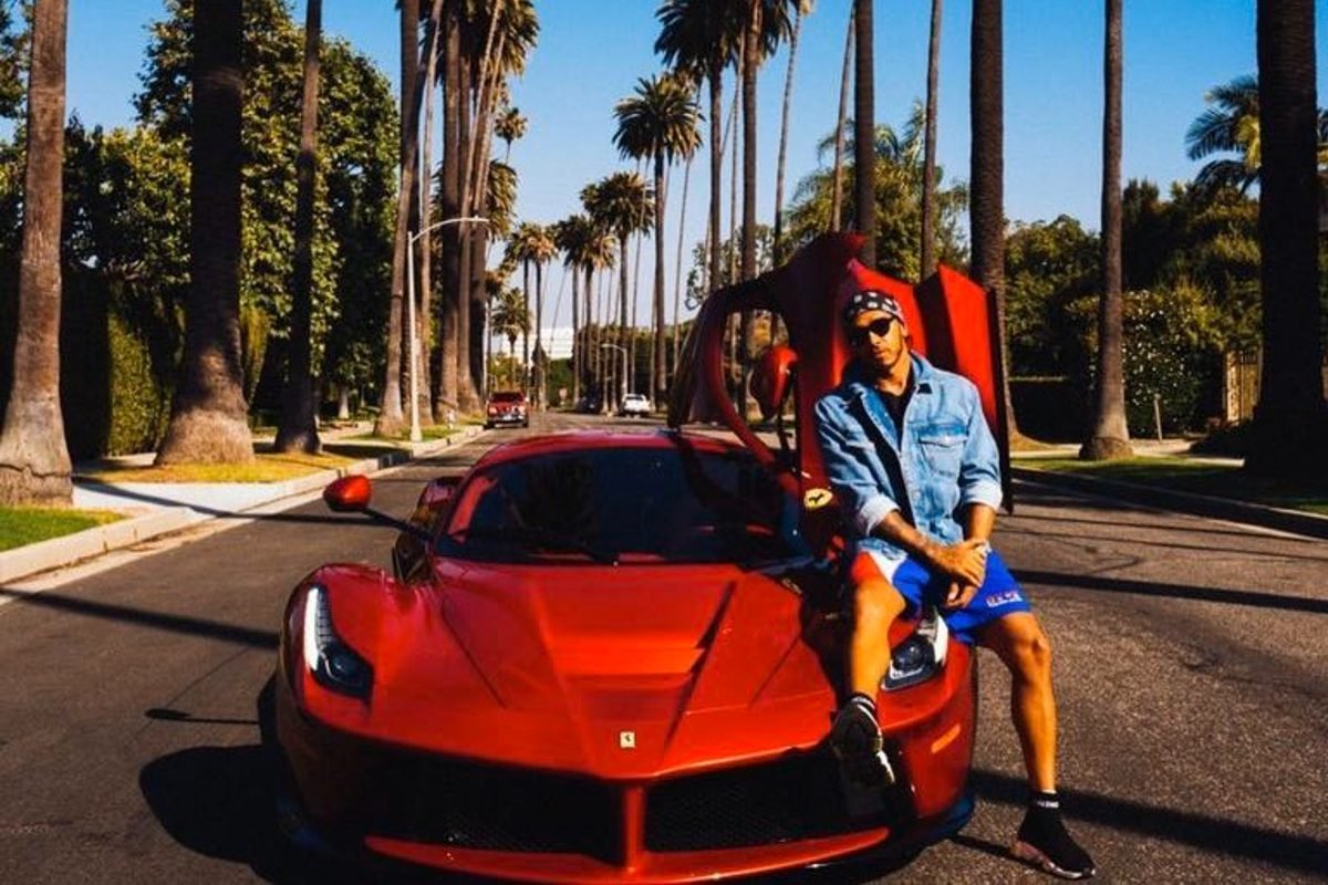 Lewis Hamilton posing with his Ferrari La Ferrari